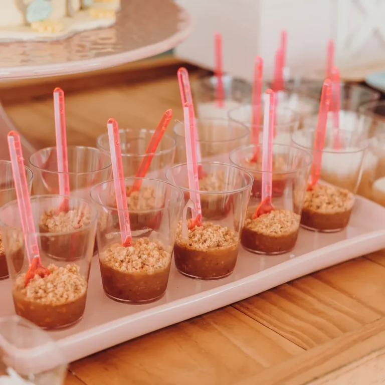 Chocolate protein pudding in a small cup with a spoon